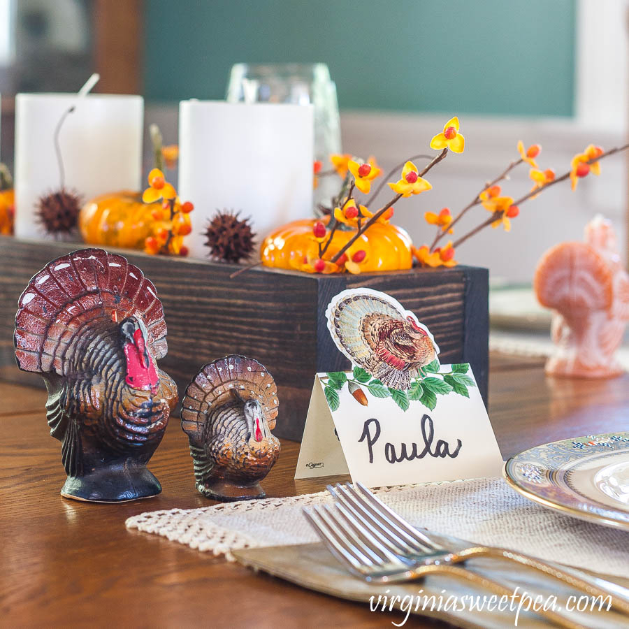 Thanksgiving table with a Caspari turkey place card and vintage turkeys