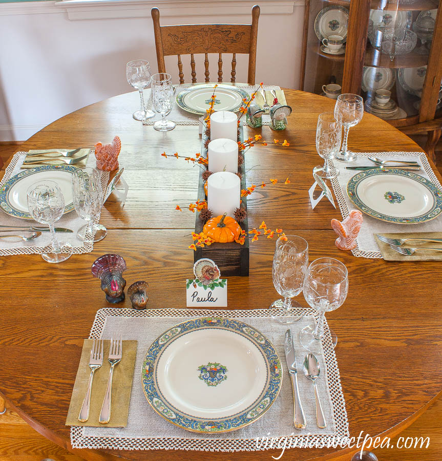 Thanksgiving table set with Lenox Autumn dishes, Gorham Golden Ribbon Edge silverware, vintage crystal, and vintage turkeys.
