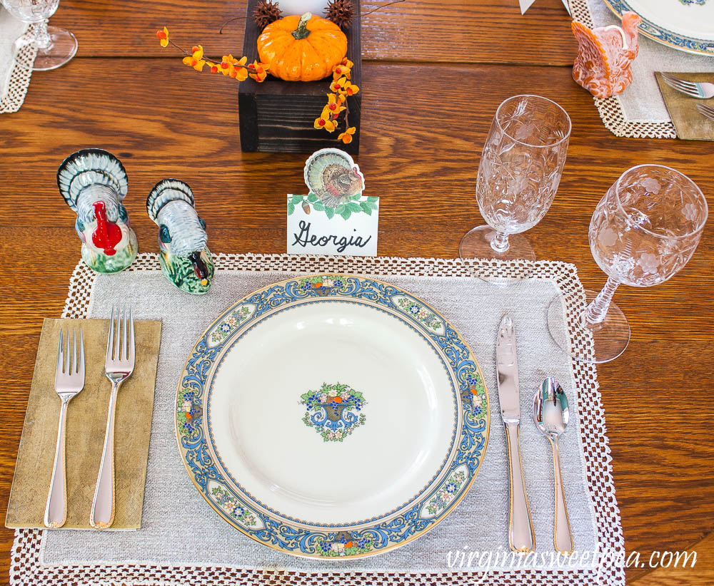 Thanksgiving Place setting with vintage turkeys, a Caspari turkey place card, vintage turkey candles, Lenox Autumn dishes, vintage Rock Sharp crystal, and Gorham Golden Ribbon Edge Silverware.
