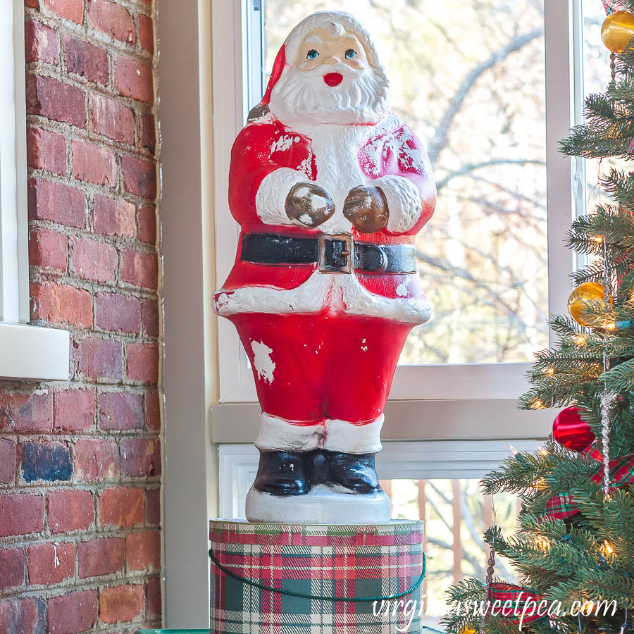 A Very Vintage Christmas on the Porch - Blow mold Santa on a vintage plaid hat box 