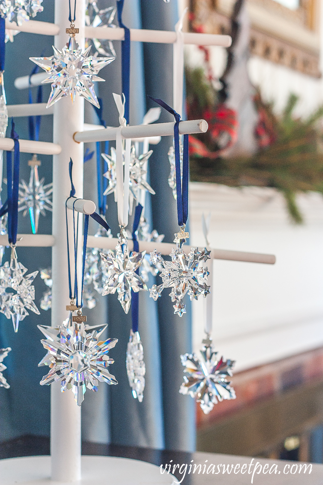 Wooden Christmas tree decorated with Swarovski snowflake Christmas ornaments dating from 1993 to 2019