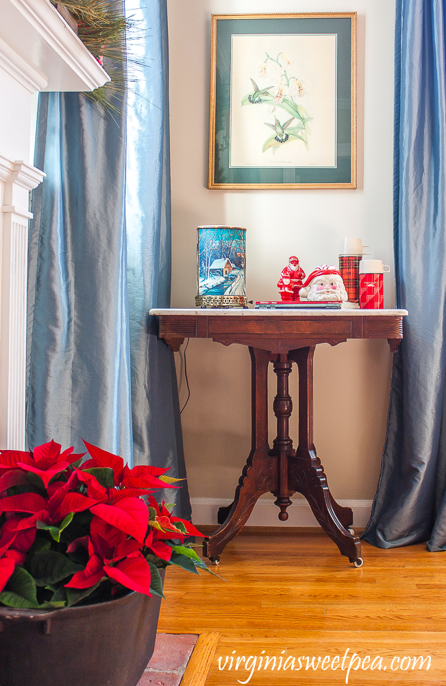 A Very Vintage Christmas in the Formal Living Room - vintage econolite, vintage plastic santas, vintage santa mug, vintage themoses, poinsettia in an antique cast iron pot