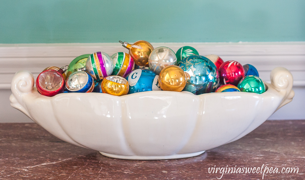 A Very Vintage Christmas in the Dining Room - Vintage ornaments in a McCoy dish.