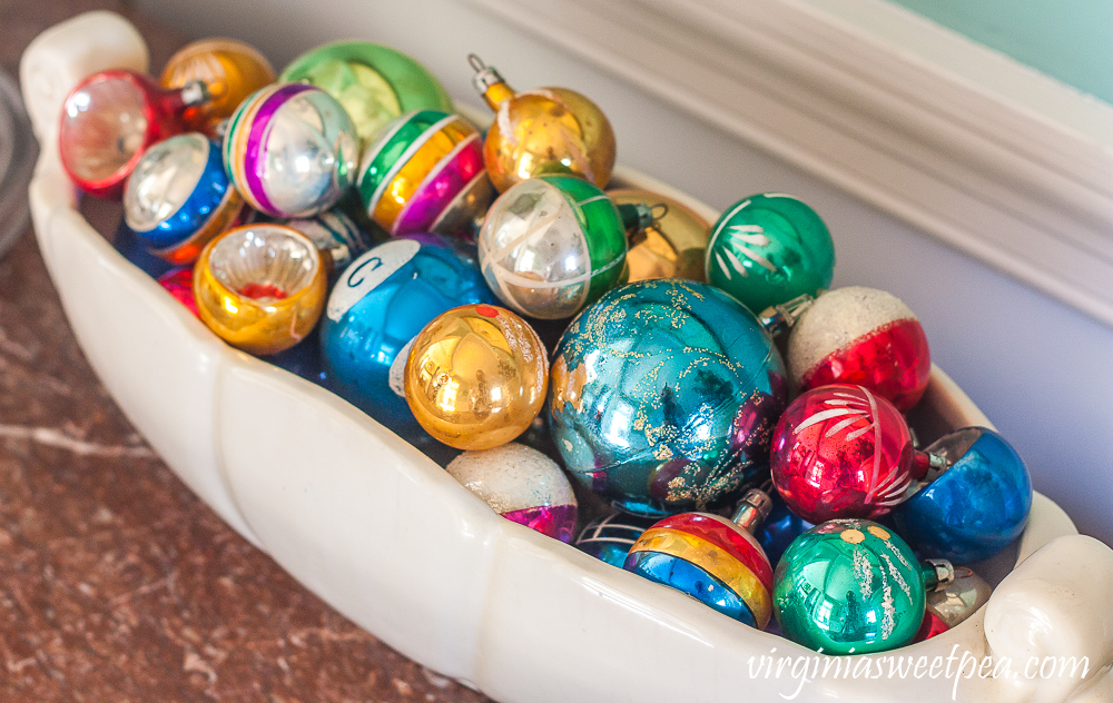 A Very Vintage Christmas in the Dining Room - Vintage ornaments in a McCoy dish.