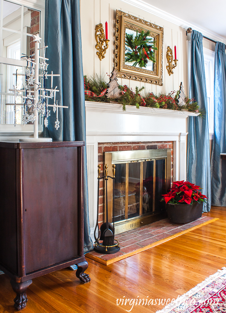 Christmas mantel decorated in a warm and rustic style with vintage