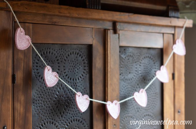 Heart Garland hanging on an antique pie safe