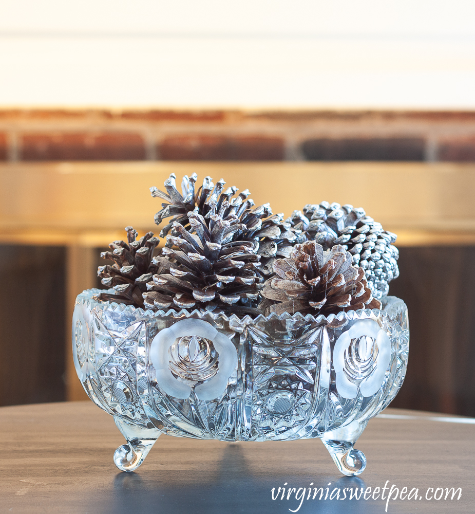 Pine Cones spray painted silver in an antique cut glass bowl.