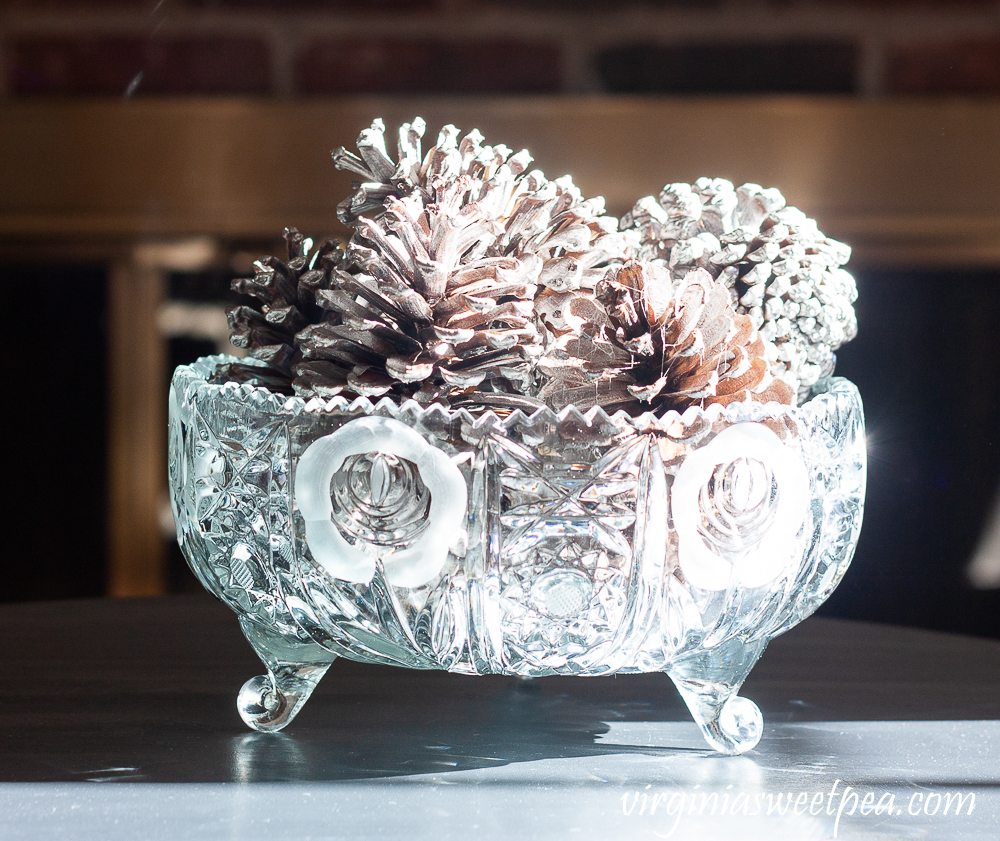 Pine Cones spray painted silver in an antique cut glass bowl.