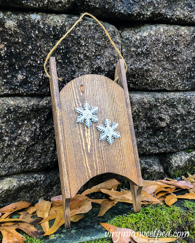 Wood sled made in the 1980s refinished and decorated with snowflakes.