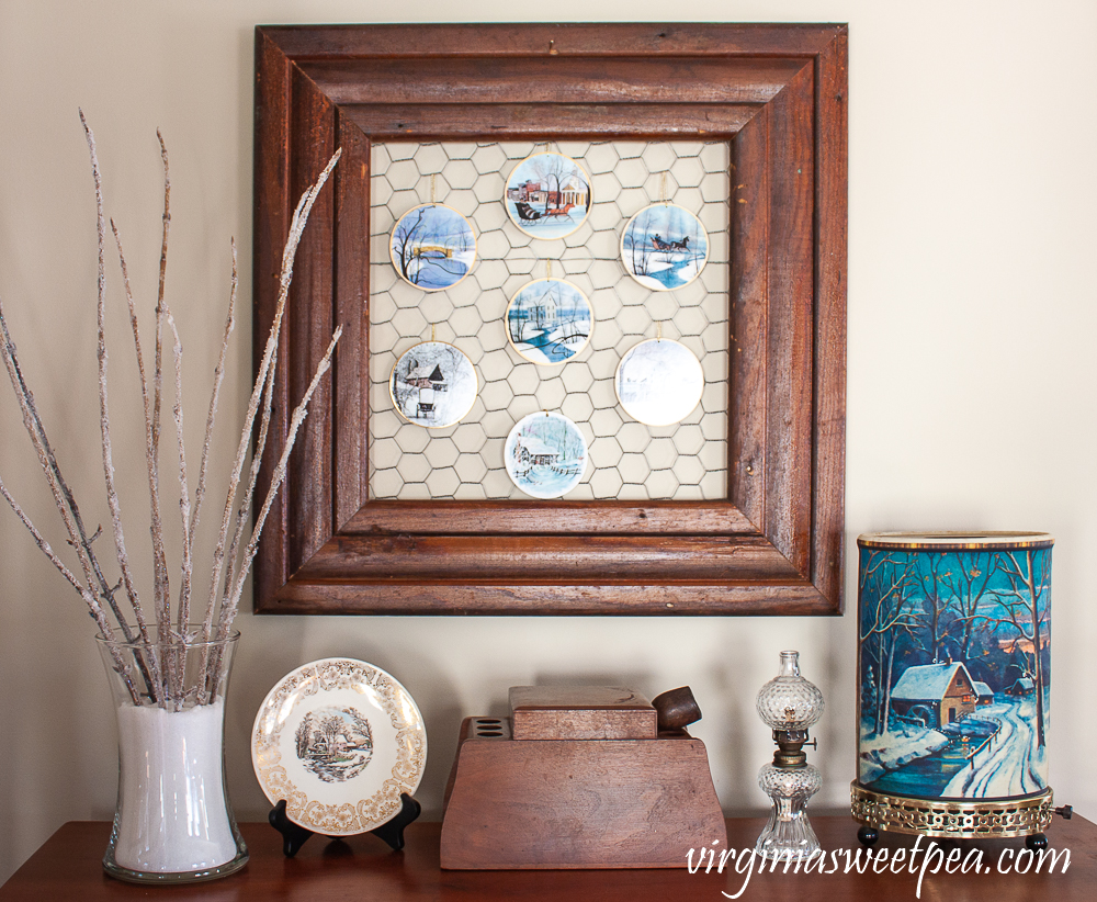 Vintage winter scene Econolite motion lamp, small antique oil burning lamp, tobacco and pipe box, winter plate, branches with epsom salt glued to them displayed in epsom salt, P. Buckley moss Christmas ornametns