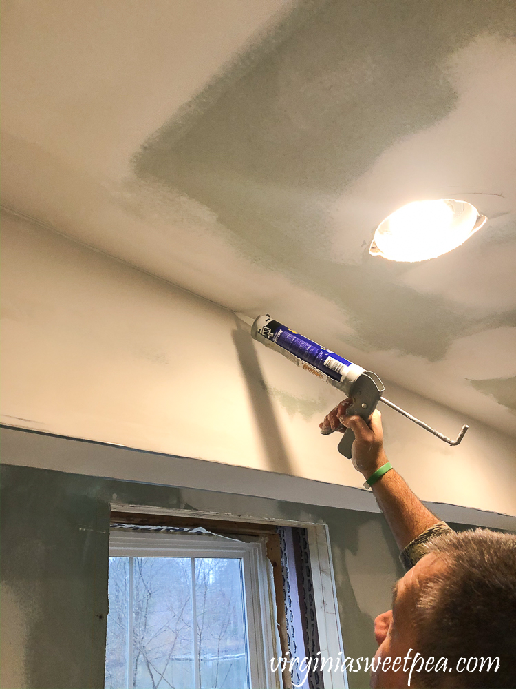 Caulking the ceiling in a basement