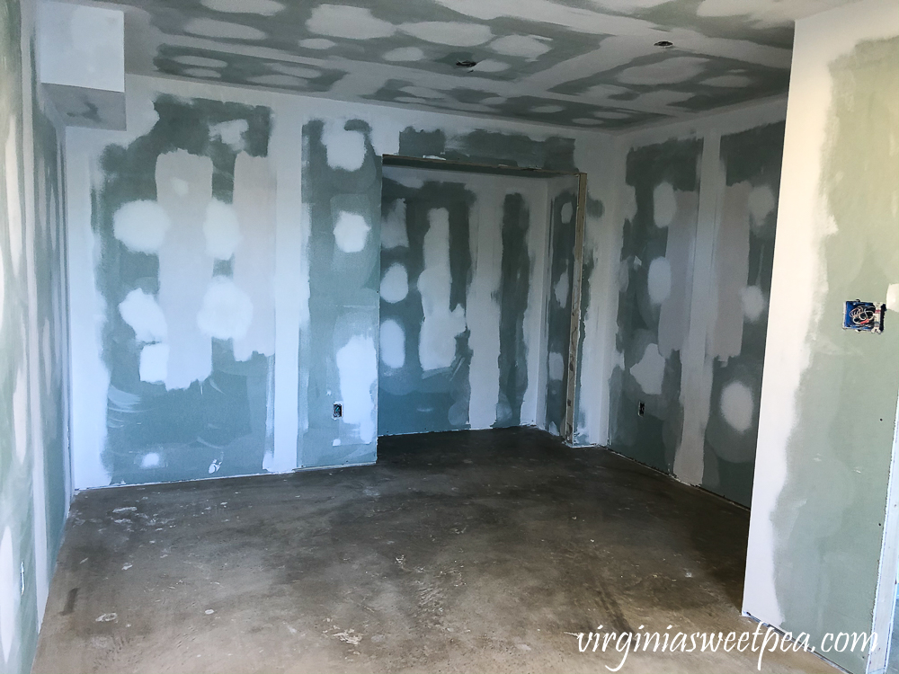 Basement after drywall has been taped, mudded, and sanded