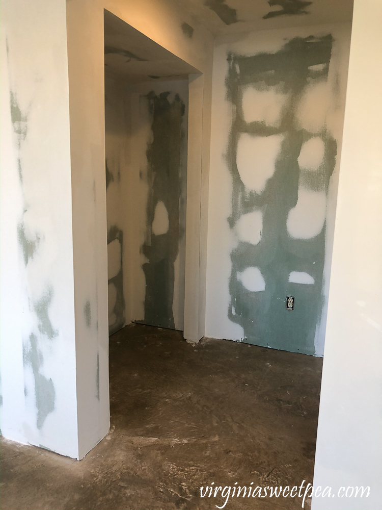 Basement after drywall has been taped, mudded, and sanded