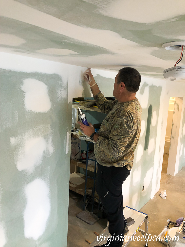 Smith Mountain Lake House Basement Project: Caulking the ceiling