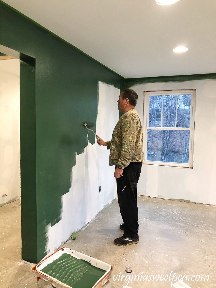 Painting walls with Sherwin Williams Emerald Paint in Rock Garden