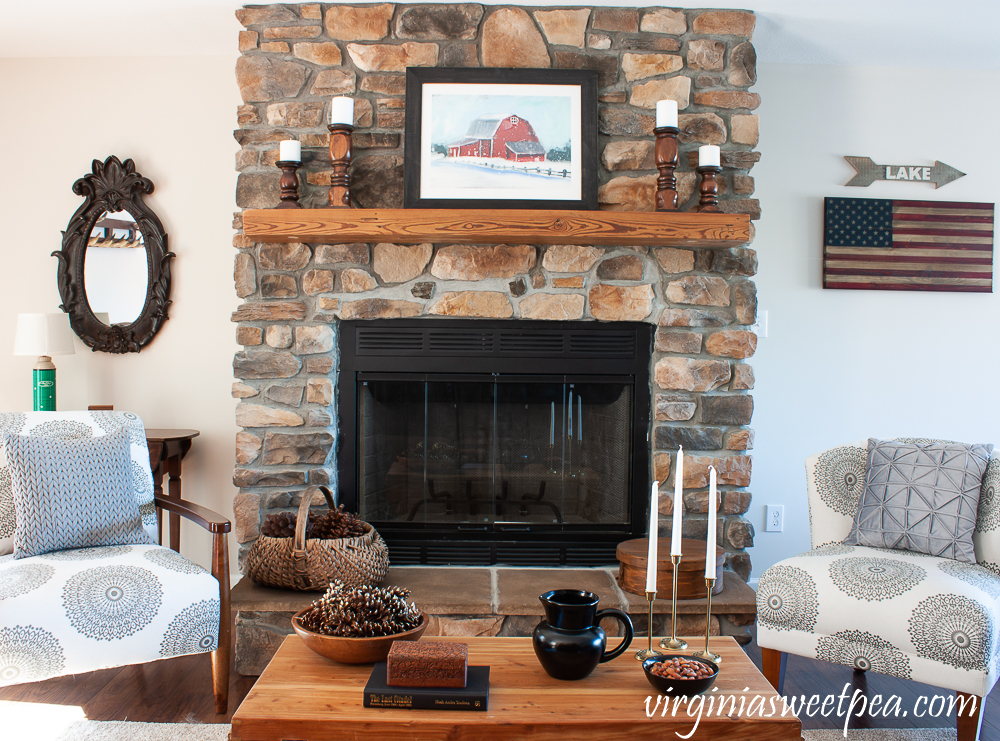 Rock fireplace in a cabin decorated for winter