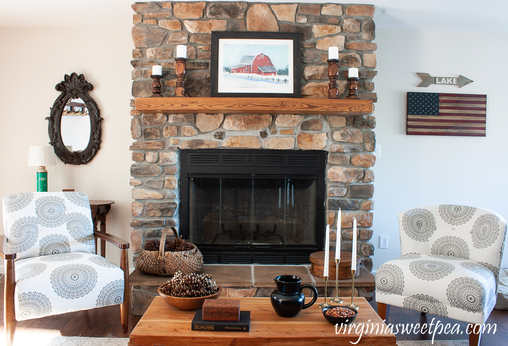 Rock fireplace in a cabin decorated for winter