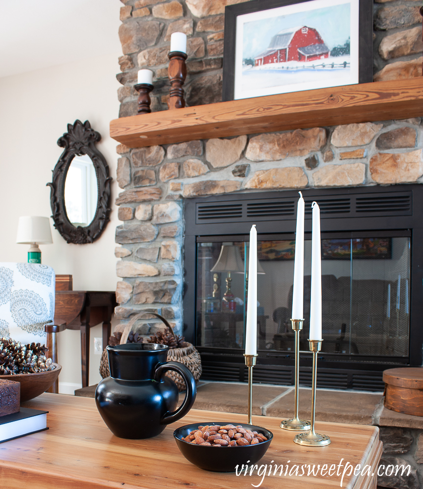 Rock fireplace in a cabin decorated for winter