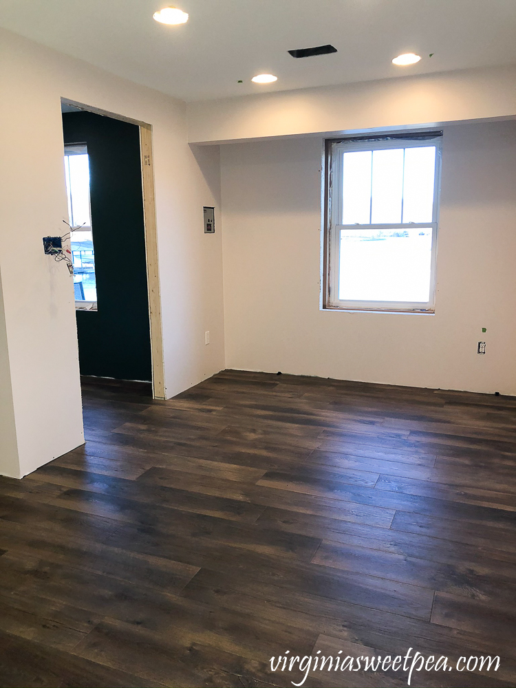 Mohawk Crest Loft flooring in Prairie Oak and Sherwin Williams Emerald Paint in Cultured Pearl