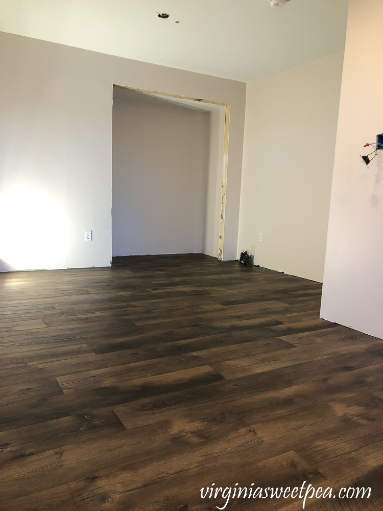 Mohawk Crest Loft flooring in Prairie Oak and Sherwin Williams Emerald Paint in Cultured Pearl