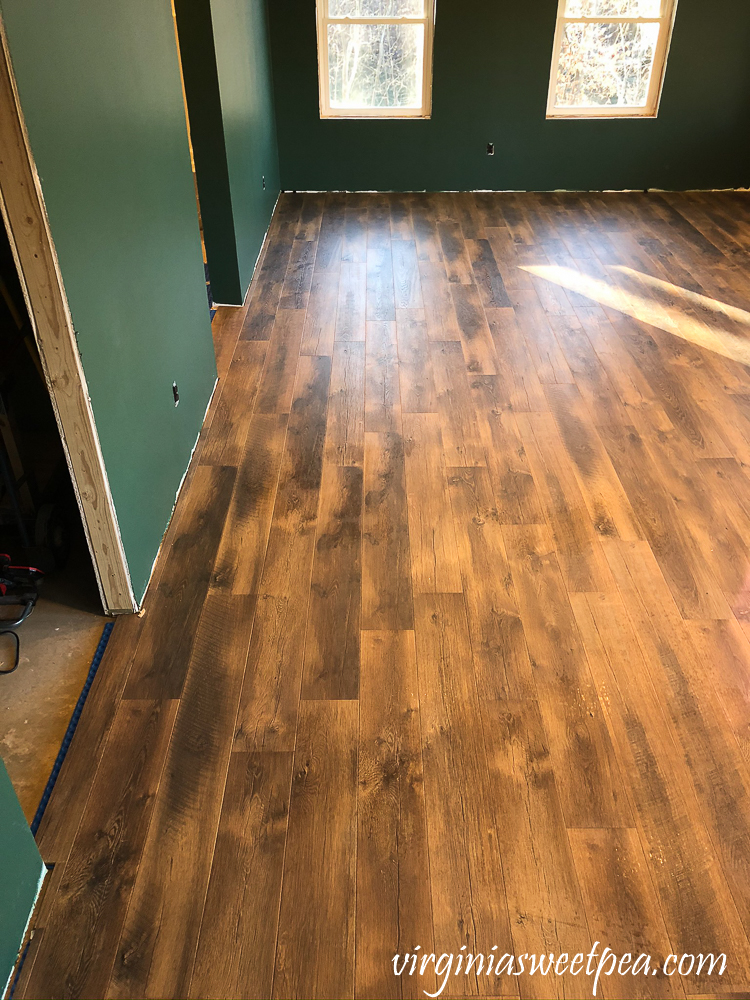 Mohawk Crest Loft flooring in Prairie Oak and Sherwin Williams Emerald Paint in Rock Garden