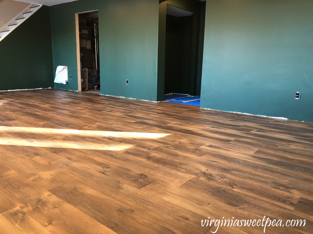 Mohawk Crest Loft flooring in Prairie Oak and Sherwin Williams Emerald Paint in Rock Garden