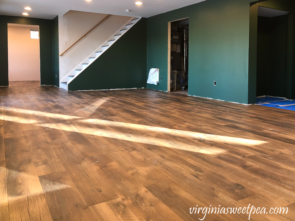 Mohawk Crest Loft flooring in Prairie Oak and Sherwin Williams Emerald Paint in Rock Garden