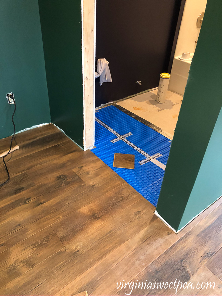 Mohawk Crest Loft flooring in Prairie Oak and Sherwin Williams Emerald Paint in Rock Garden