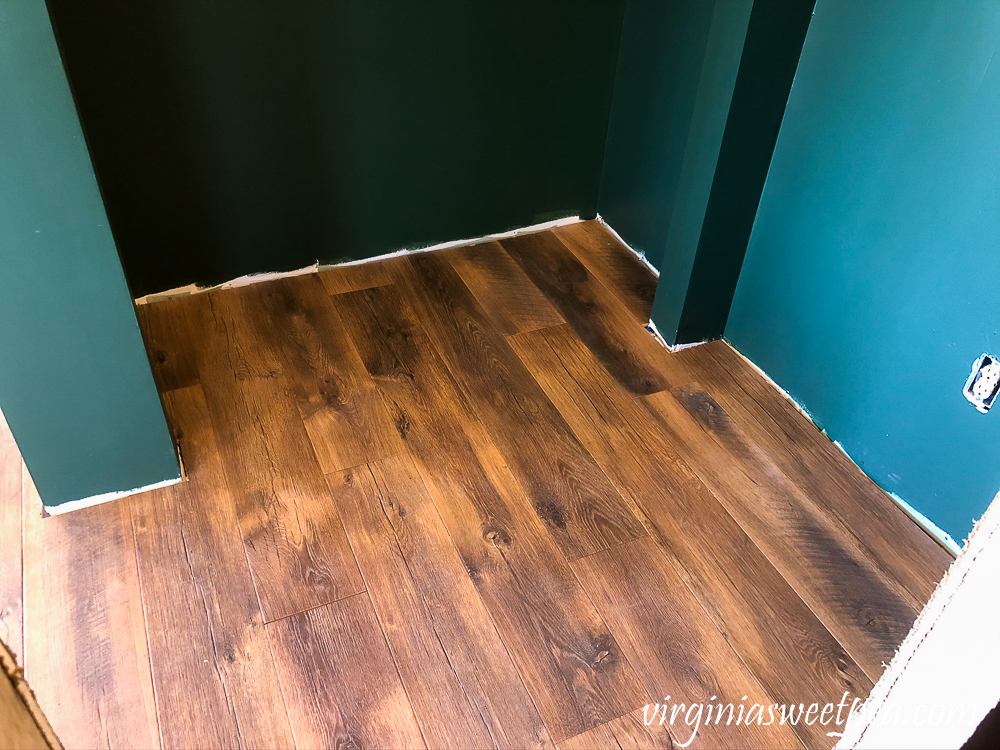 Mohawk Crest Loft flooring in Prairie Oak and Sherwin Williams Emerald Paint in Rock Garden