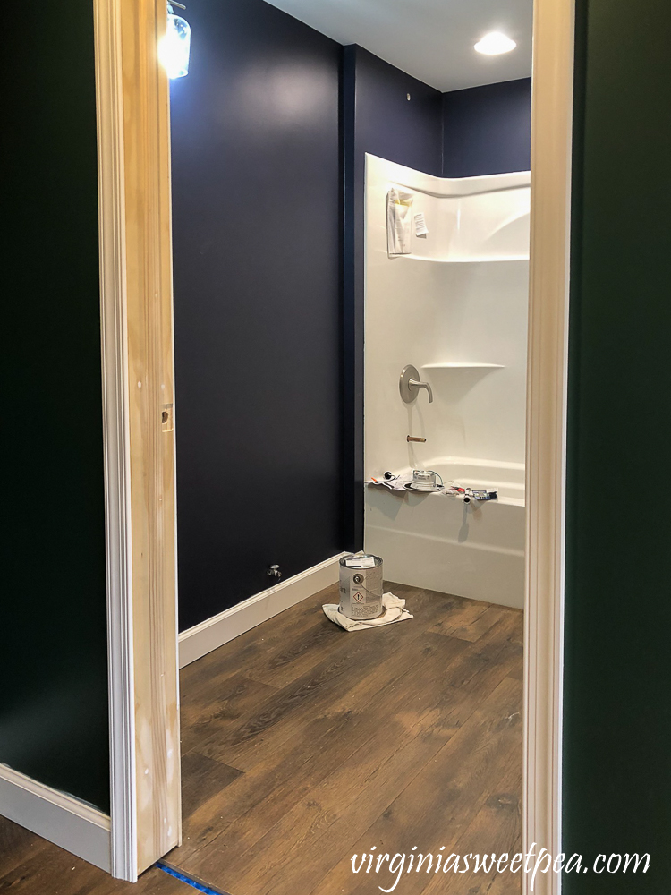Bathroom with Walls Painted with Sherwin Williams Emerald Paint in Charcoal Blue