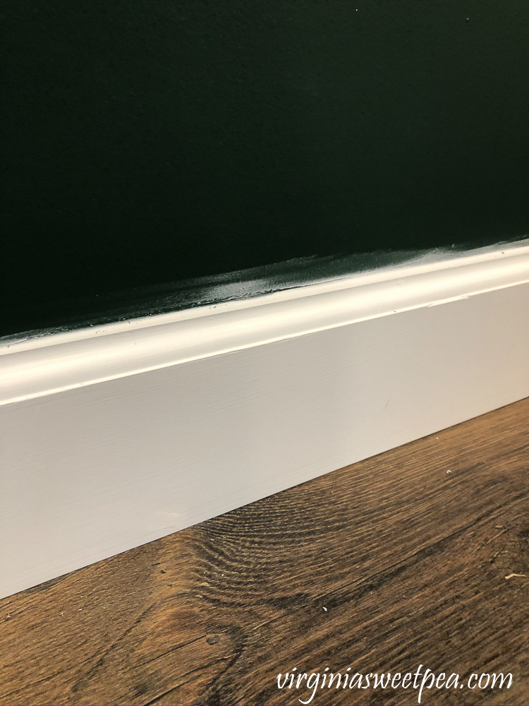 Caulking smear above baseboard