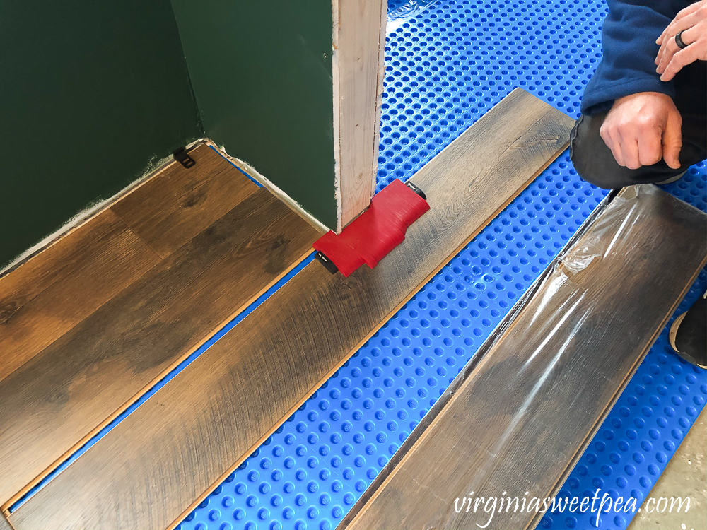 How to cut a vinyl floor plank around a door opening.