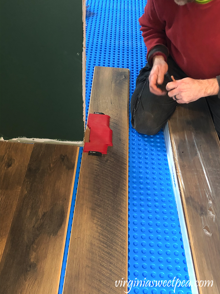 How to cut a vinyl floor plank around a door opening.