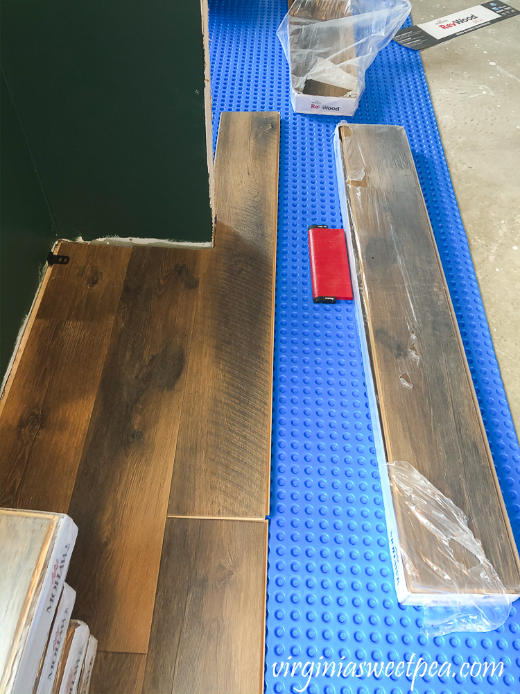 How to cut a vinyl floor plank around a door opening.