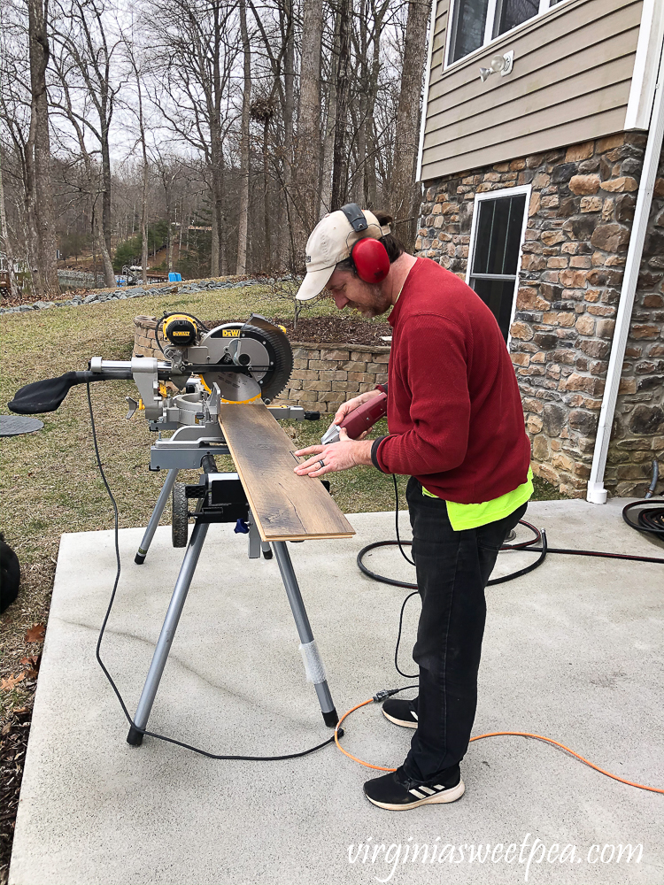 How to cut a vinyl floor plank around a door opening.