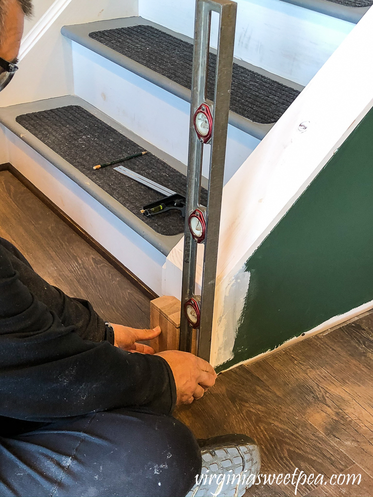 Installing a newel post at the bottom of a set of stairs