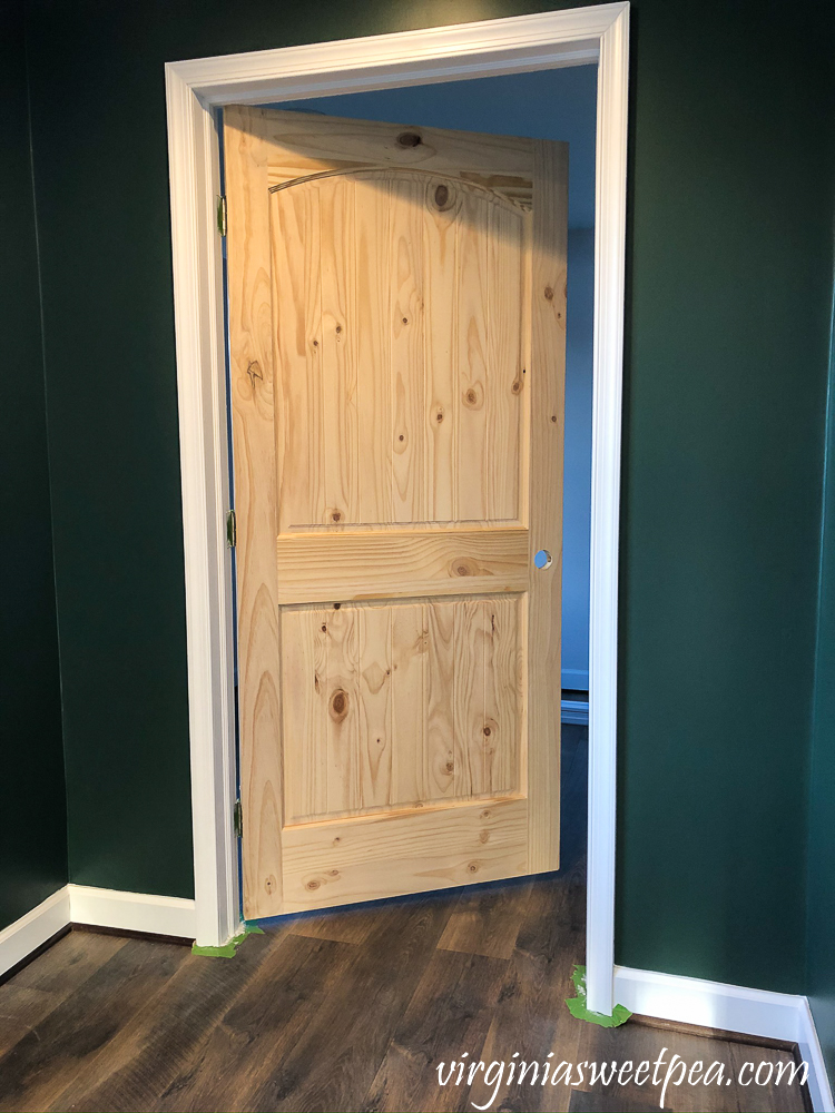 Trim painted around a wood door