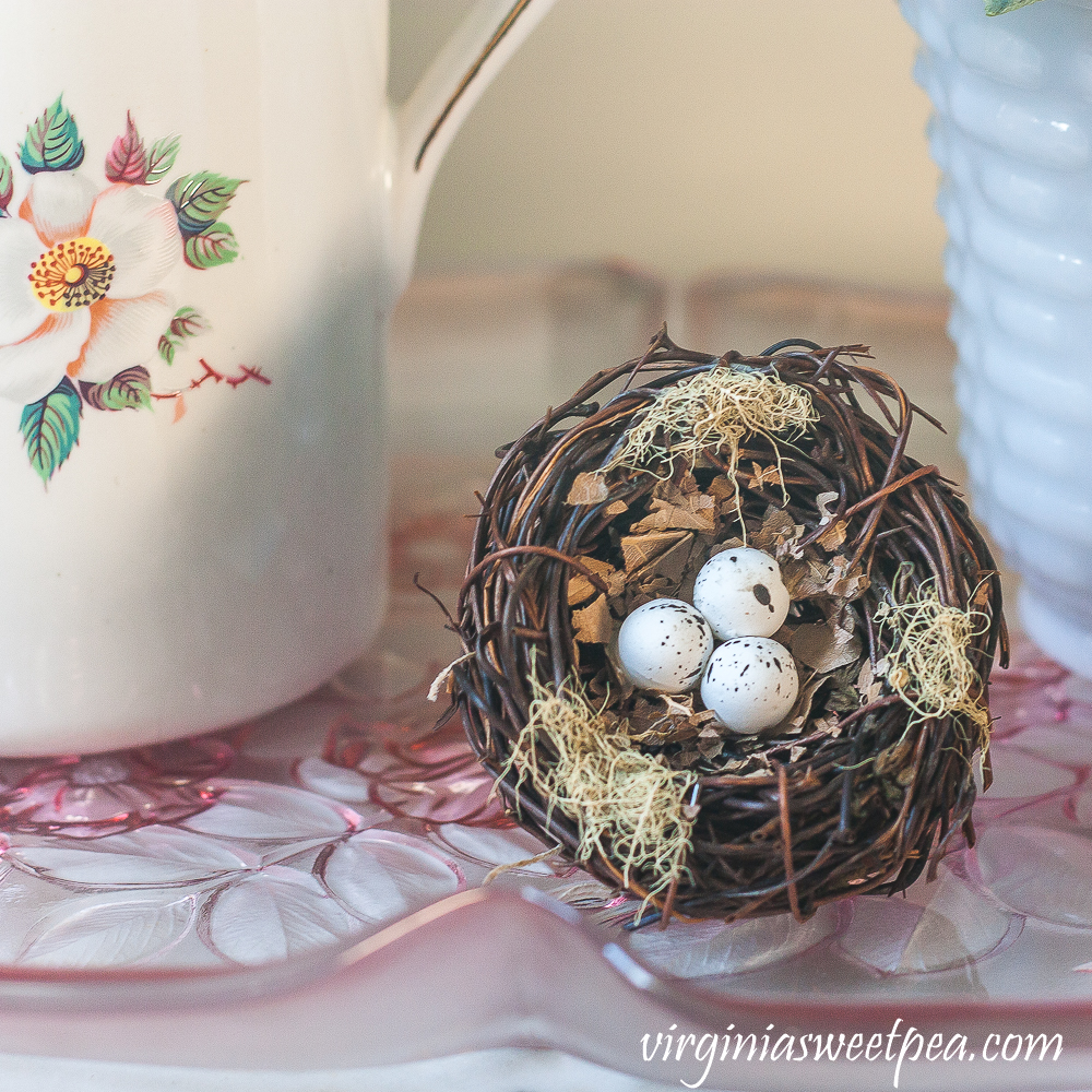 Bird nest on a pink glass tray