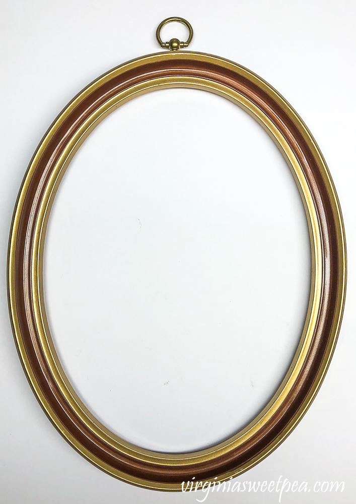 oval brass and brown picture frame