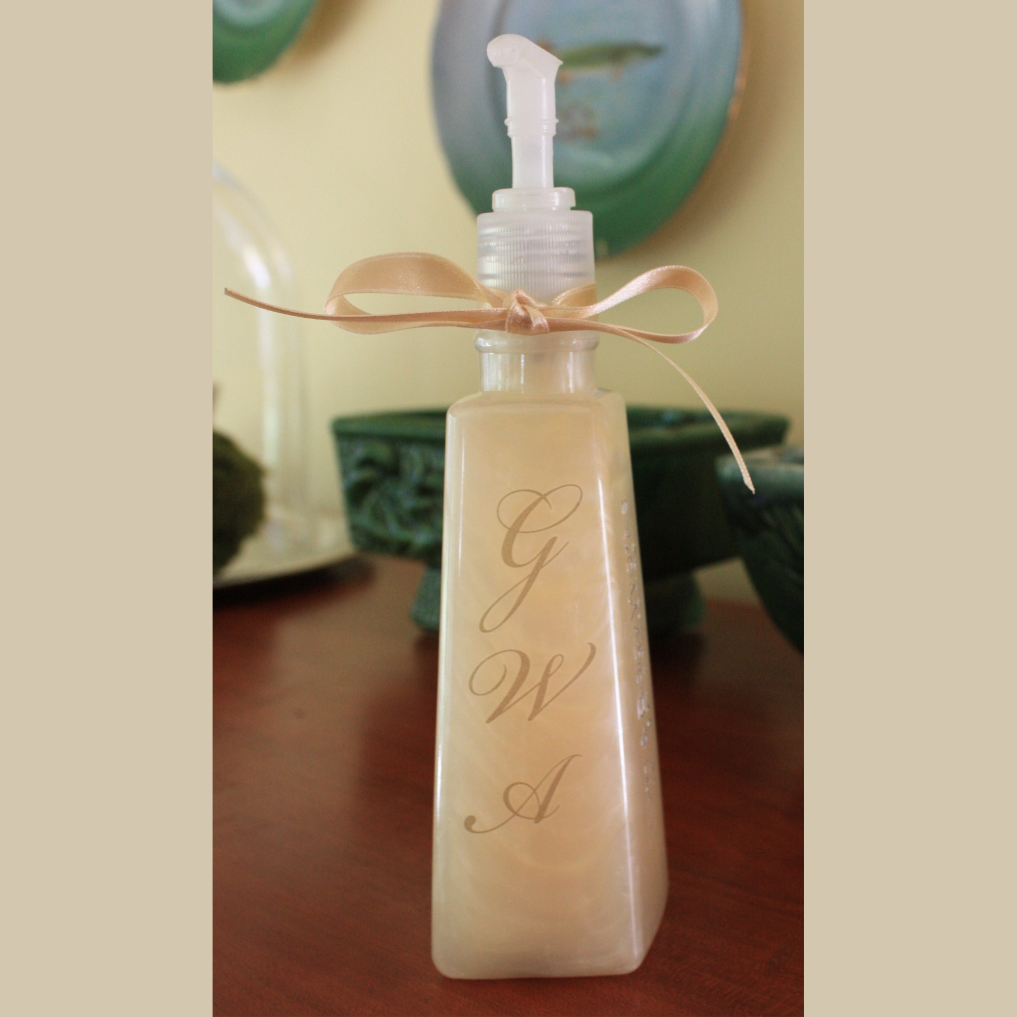 Repurposed Soap Container embellished with rub-on initials and a ribbon