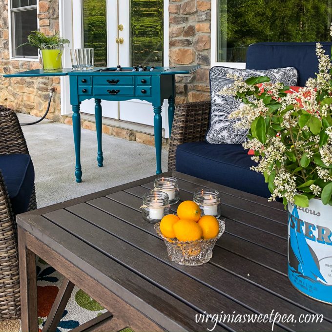 Outdoor patio with a bar made from an old sewing machine table