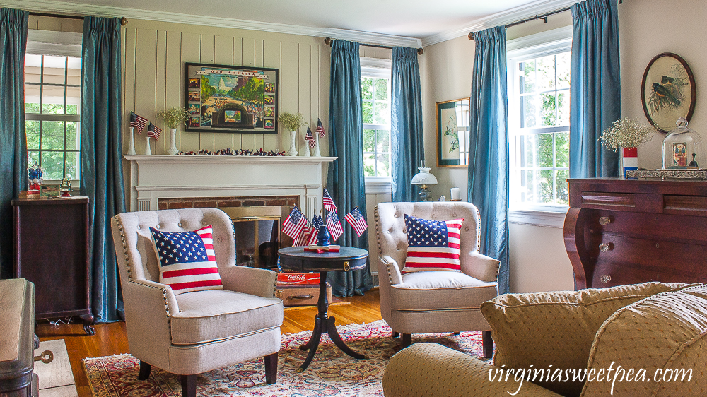 Living room and mantel decorated patriotically with vintage.