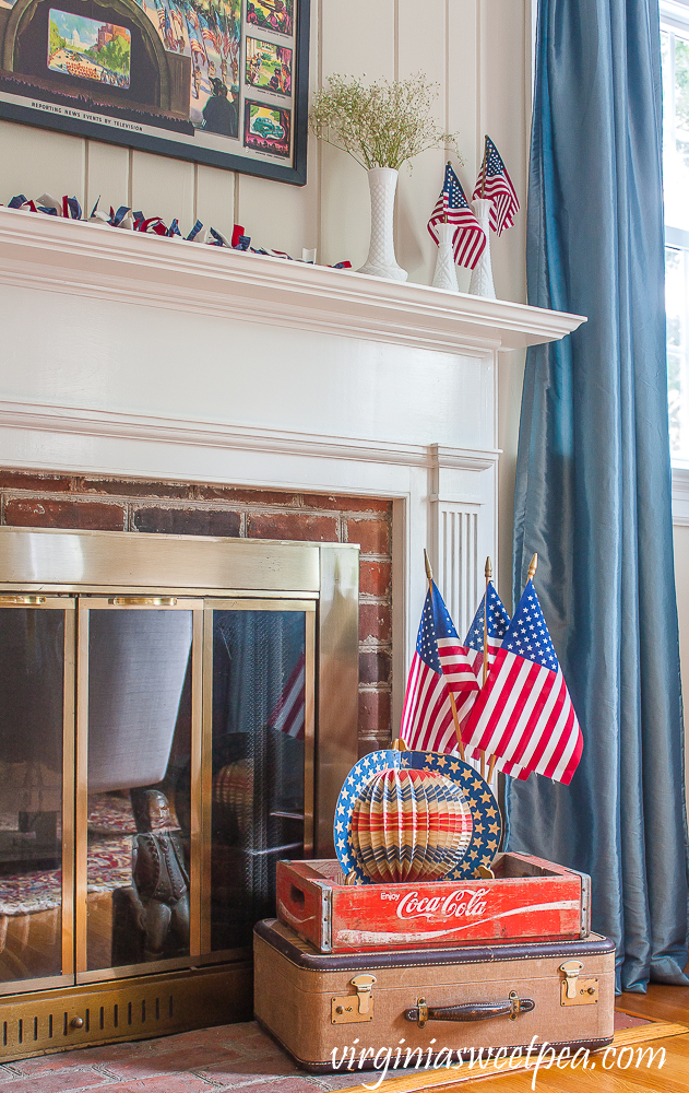 Living room and mantel decorated patriotically with vintage.