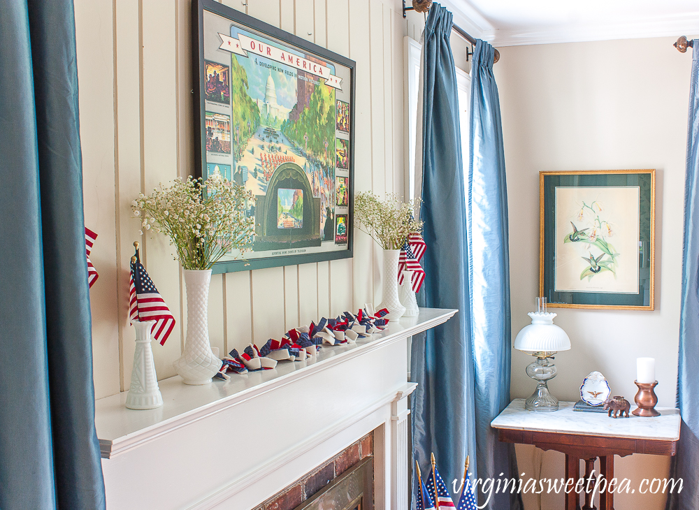 Living room and mantel decorated patriotically with vintage.