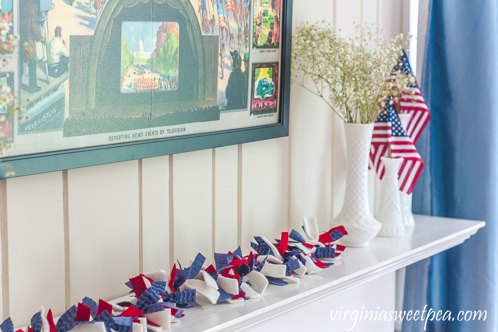 Patriotic rag garland made with blue quilting fabric, red wool, and white fleece