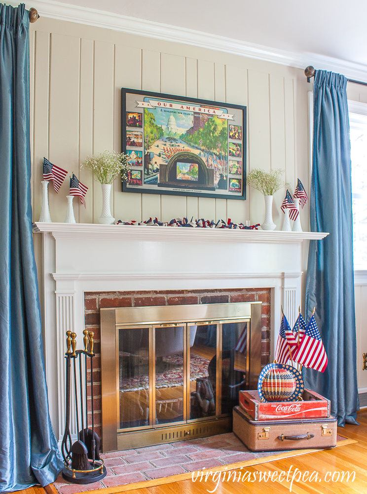 Living room and mantel decorated patriotically with vintage.