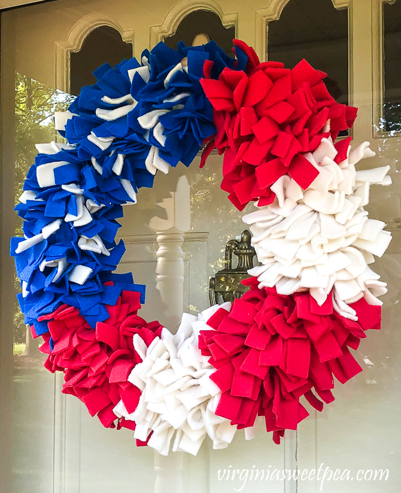 Rag wreath made with strips of red, white, and blue fleece.