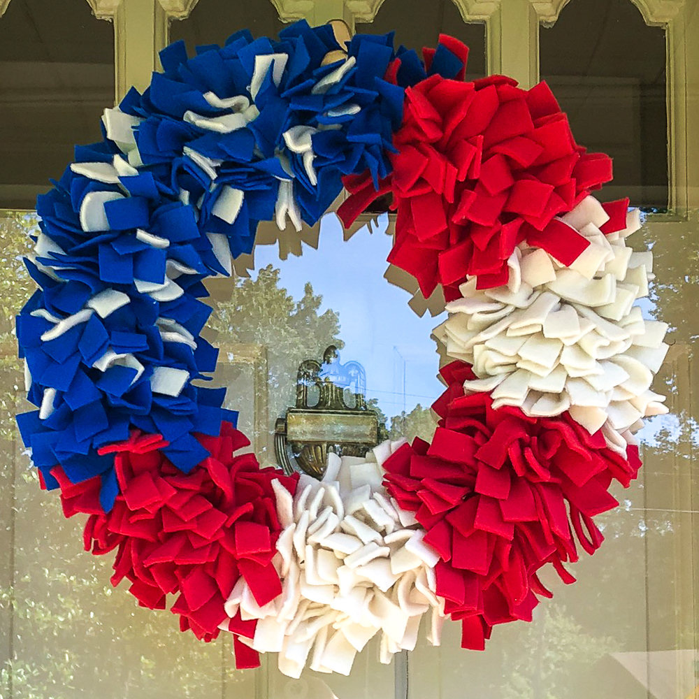 Red, white, and blue wreath made with fleece strips.