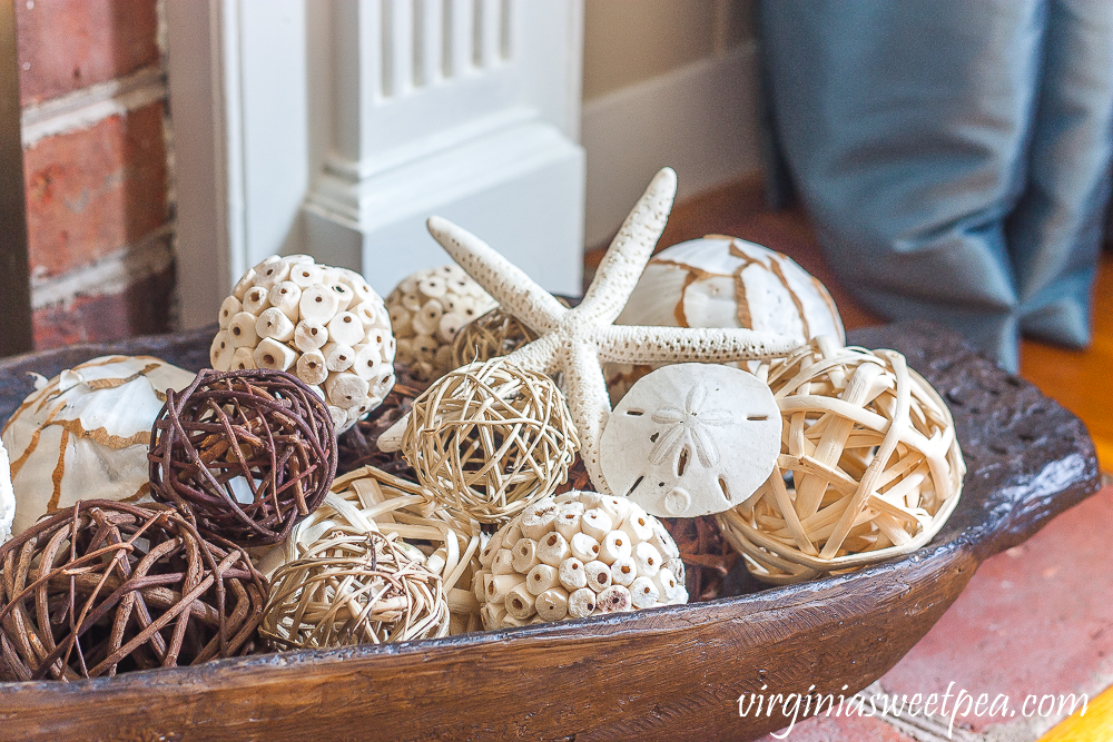 Dough bowl decorated with woven spheres and a starfish and sand dollar.