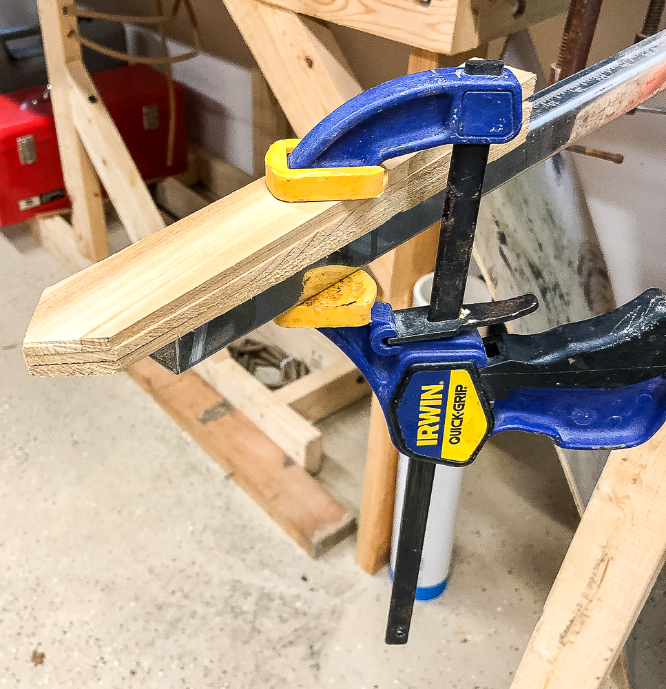 Cutting points on the ends of a DIY wood burned plant marker.